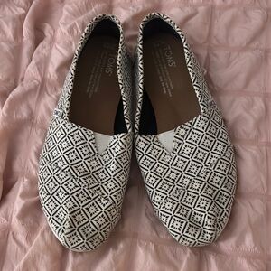 TOMS Women's Black and White Slip-On Shoes.